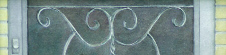 Detail of the door, the grille, handle and bricks.
